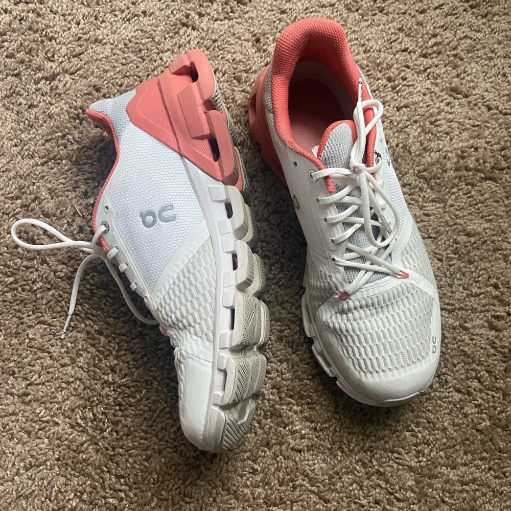 White and pink on cloud running shoes
